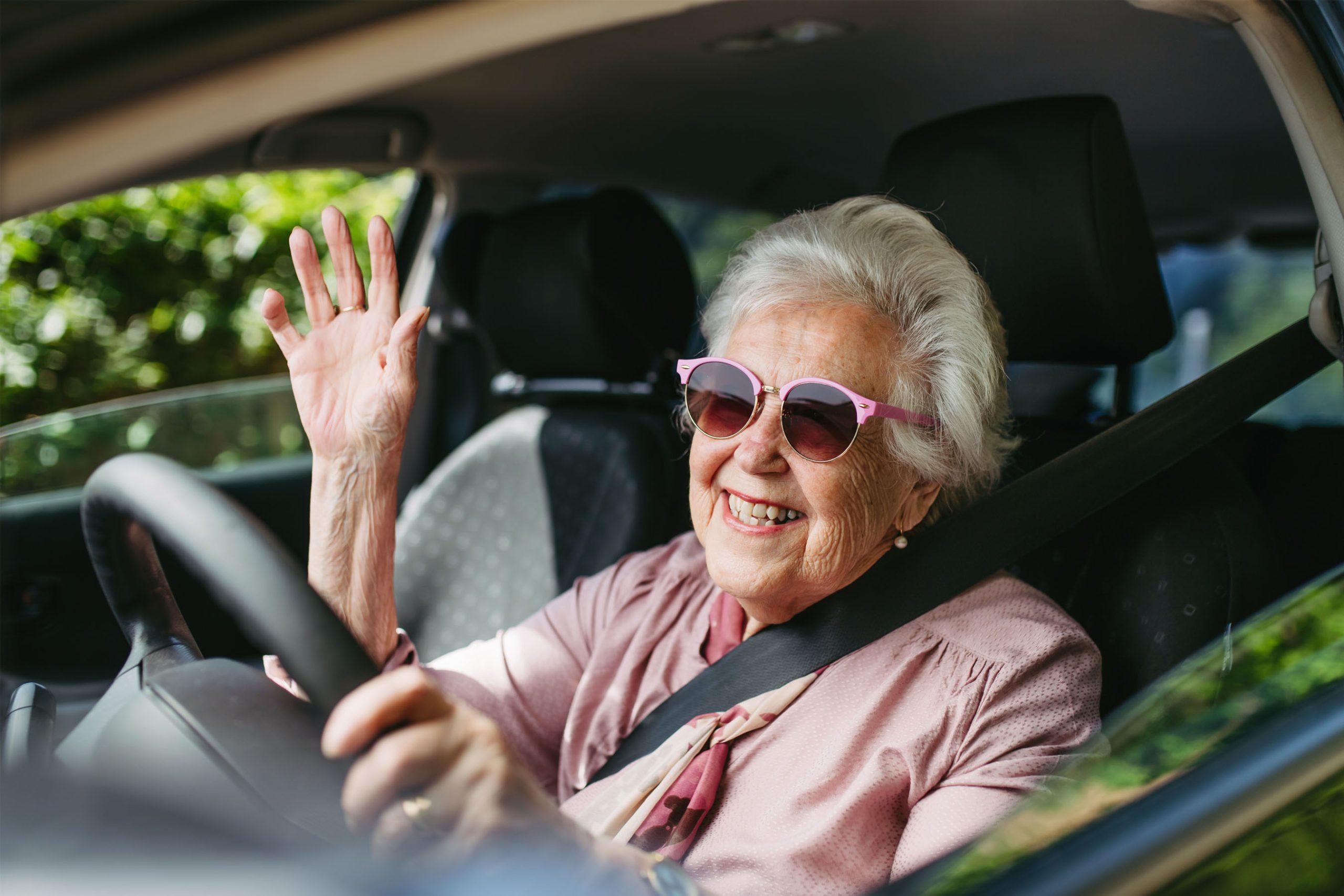 Happy,Senior,Woman,Driving,Car,Alone,,Enjoying,Car,Ride.,Safe